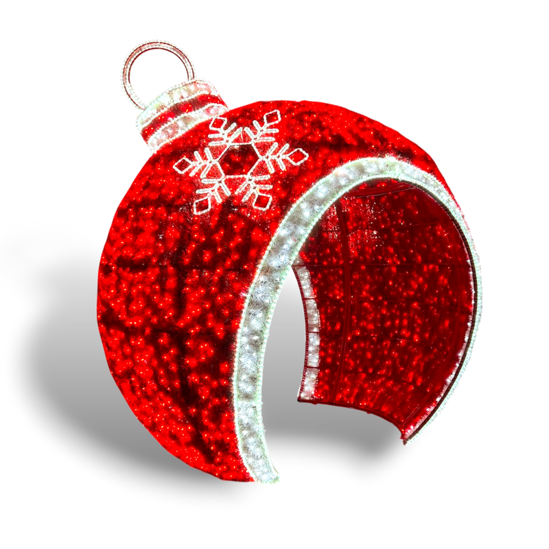 Isolated red LED walk-through Christmas ornament sculpture with snowflake design and glowing white trim, shown on transparent background for design use