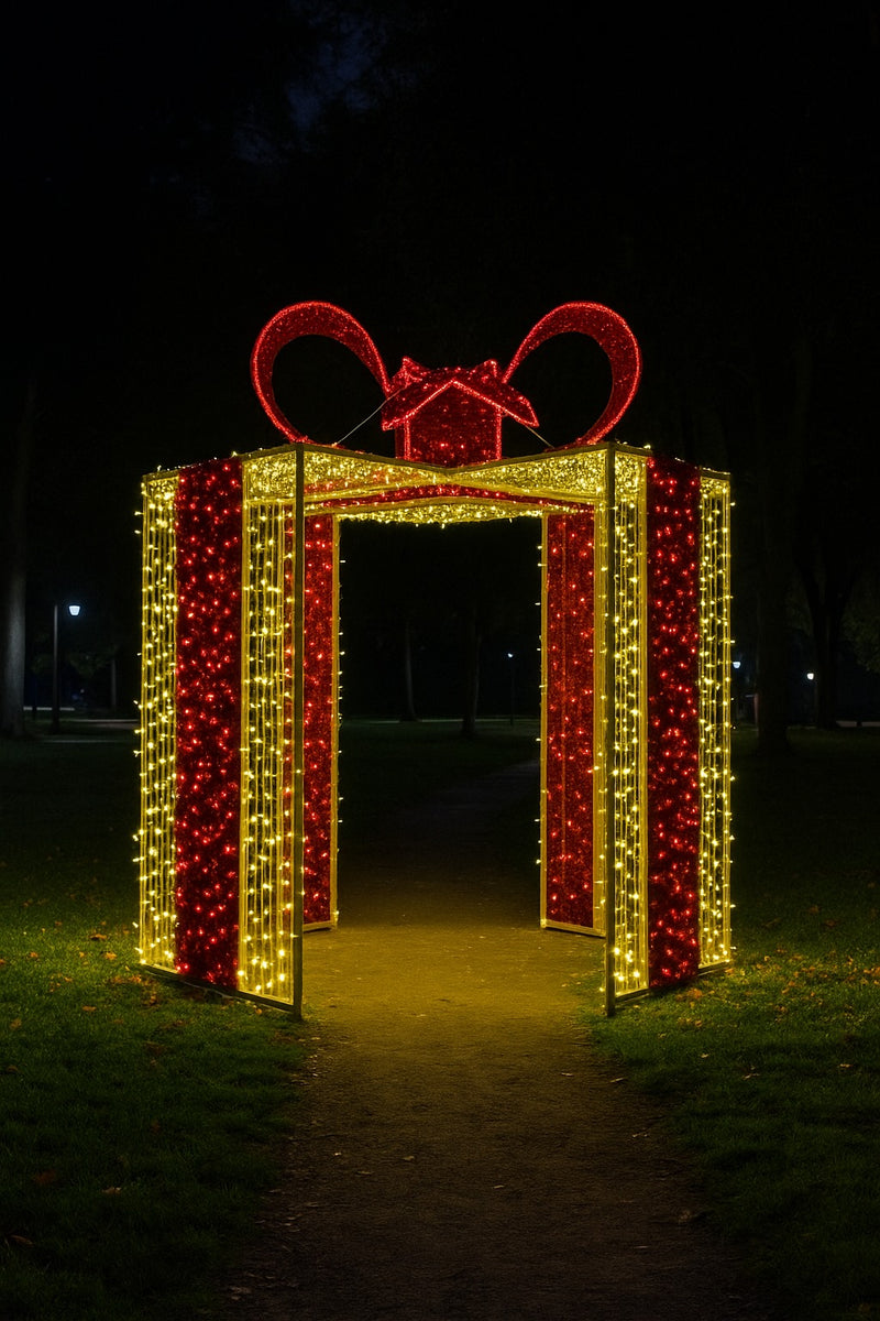 Giant illuminated Christmas gift box arch with red and gold LED lights for outdoor holiday displays
