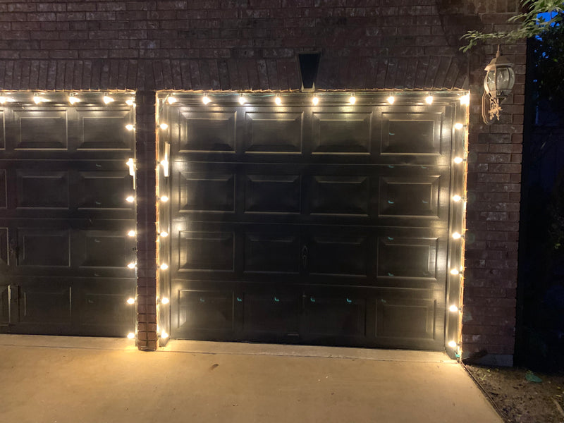 Picture of a garage outlined in C9 bulbs for Christmas